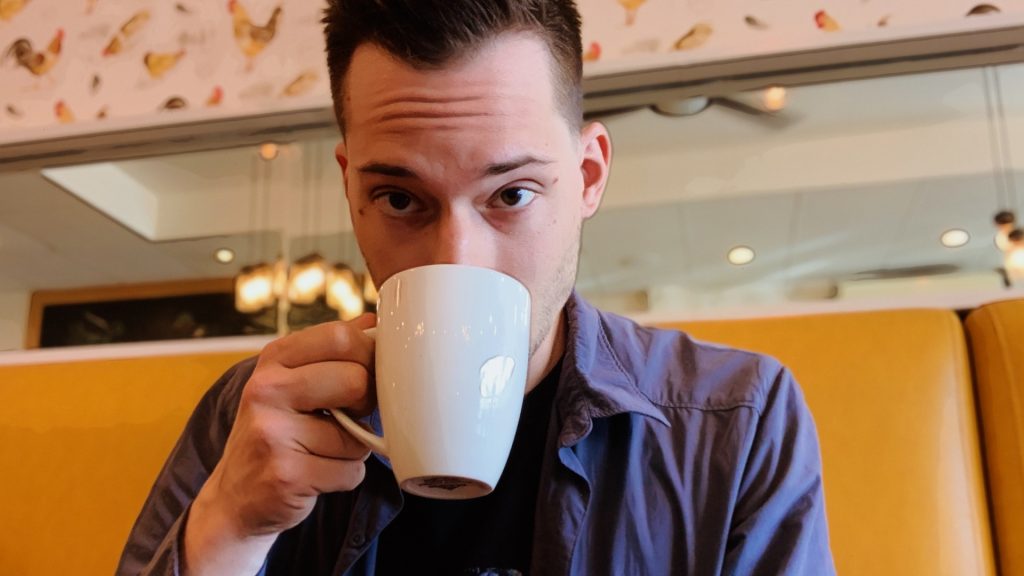 ScootyDub sipping coffee at Namo Cafe