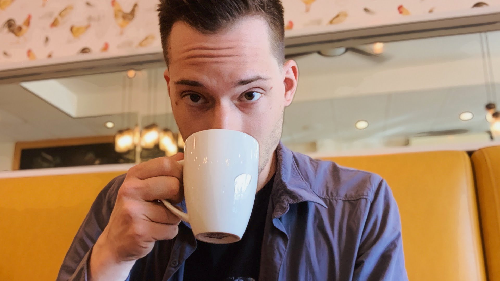 ScootyDub sipping coffee at Namo Cafe