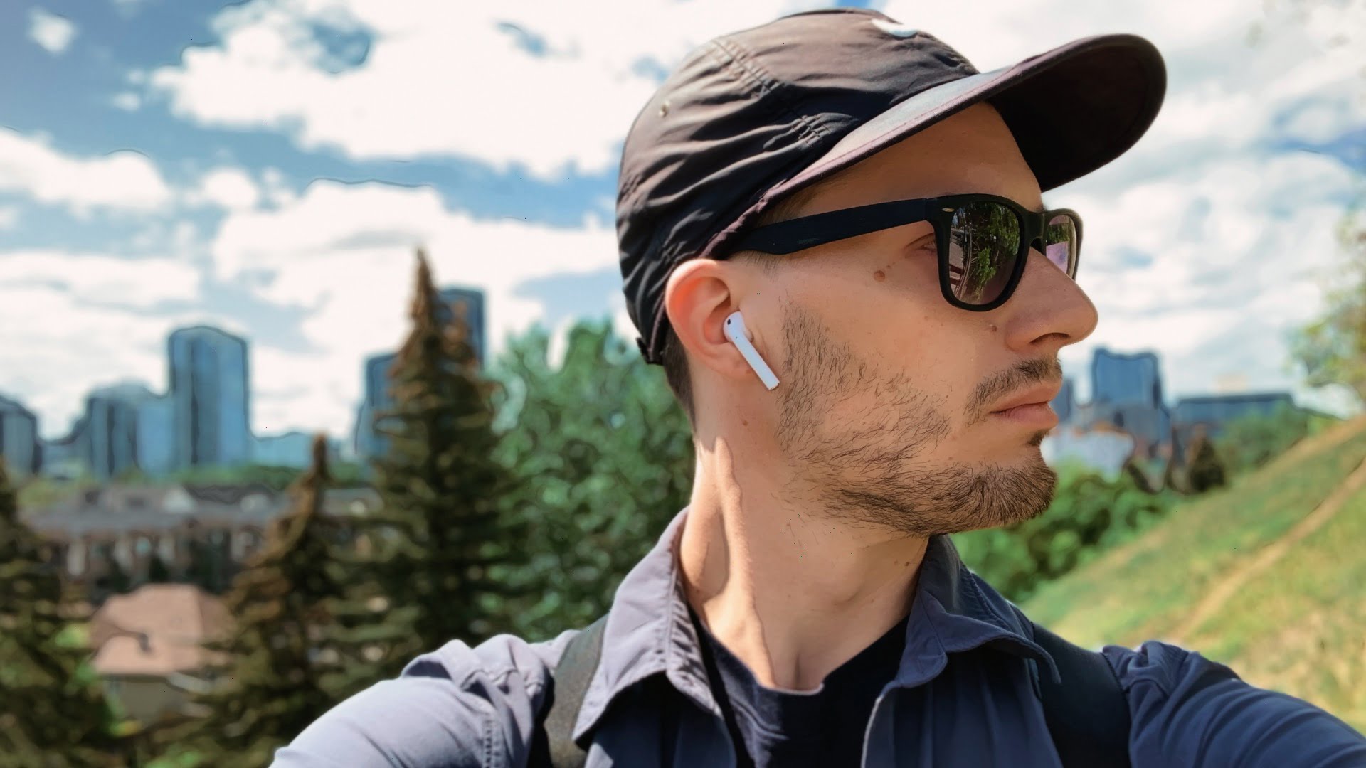 ScootyDub looking sideways with Calgary skyline background