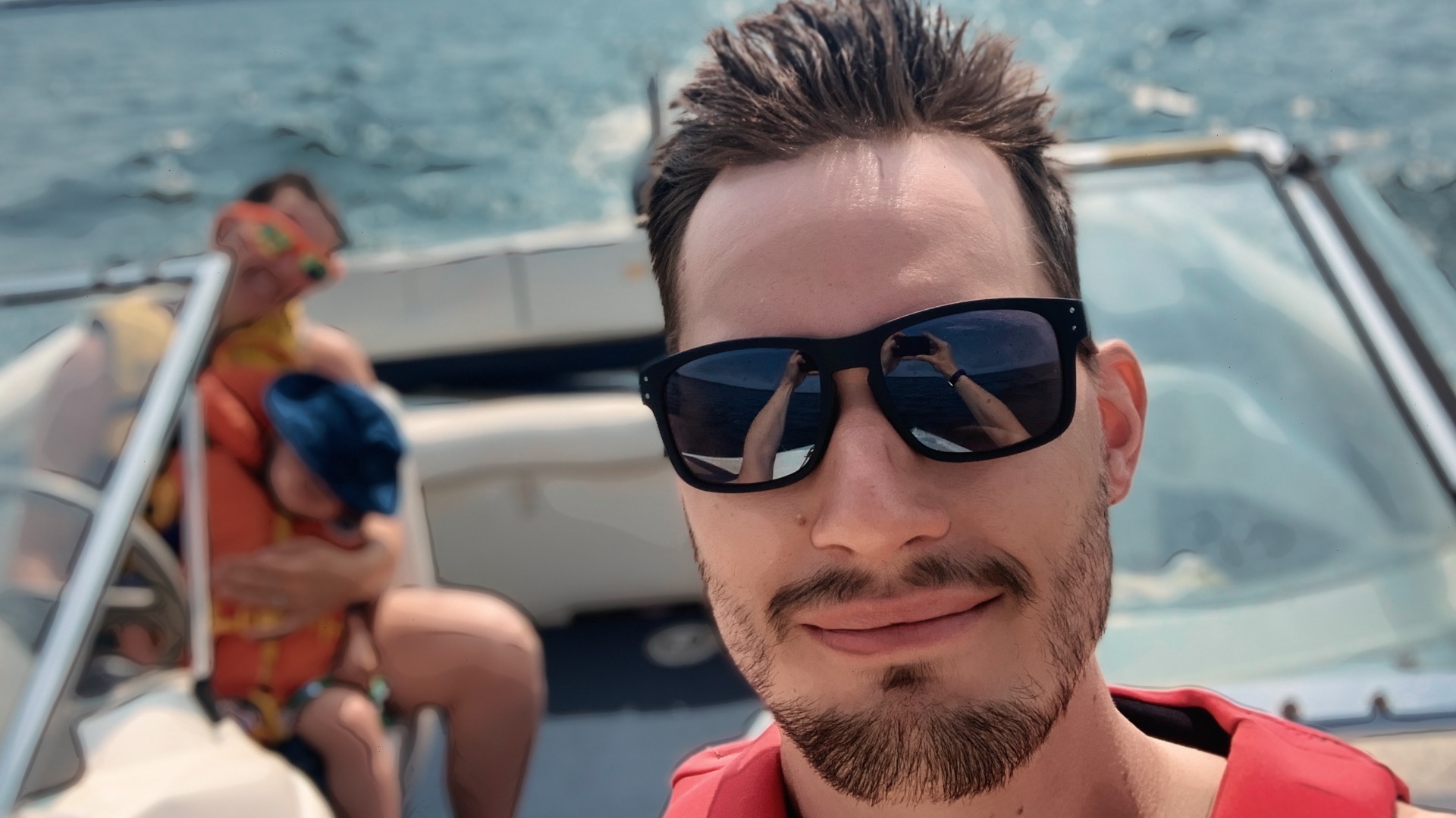 Scootydub smiling on a boat on Wabamun Lake, Alberta